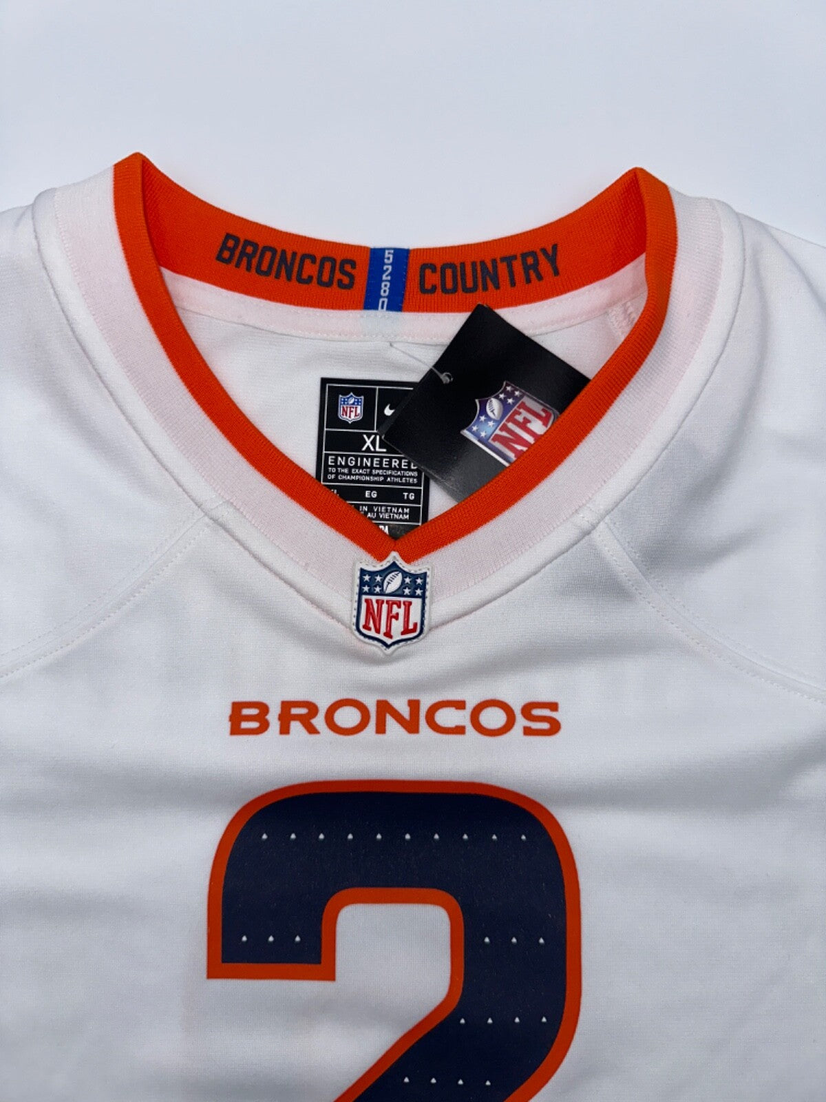 $90 Nike Youth Denver Broncos Patrick Surtain II Jersey - White/Orange- XLarge