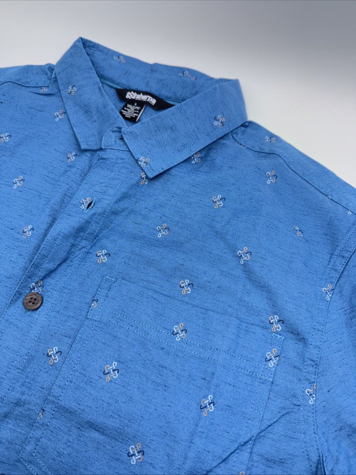 Sherpa Men’s  Tharu Short Sleeve Button Shirt- Lapis Endless Knot Blue- Small